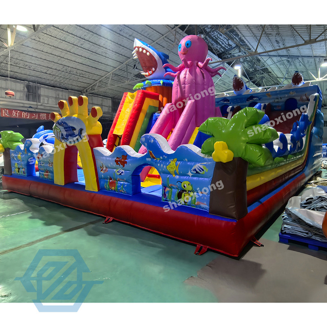  Parco giochi gonfiabile per parco tematico oceanico con scivolo da arrampicata